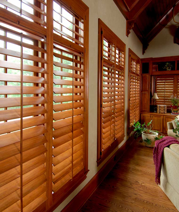 natural stain shutters on row of windows